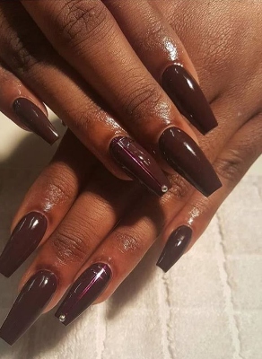 How The Chocolate Nail Trend Perfectly Complements Melanin-Rich Skin